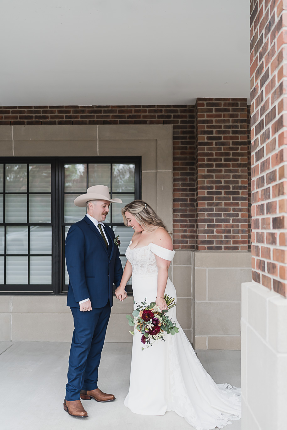 Romantic Royal Park Hotel wedding in Michigan with classic navy and sage details, warm family moments, and timeless photography by Kari Dawson.