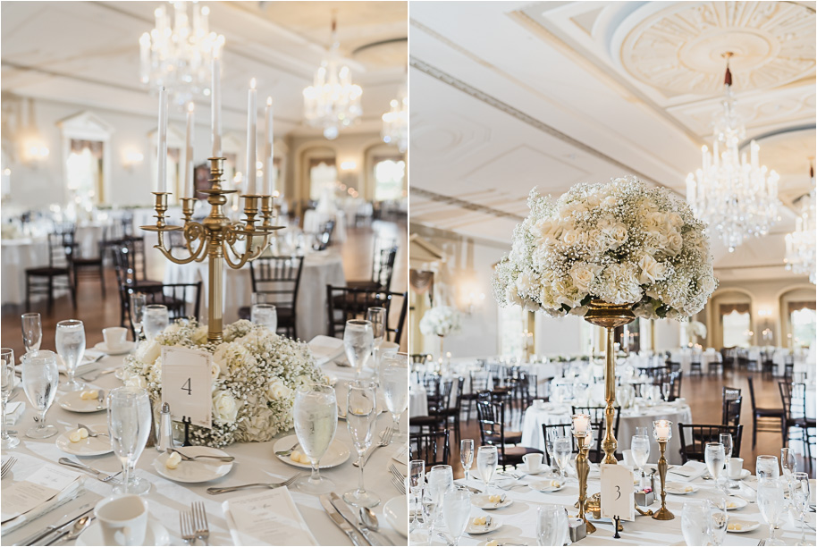 Elegant white rose and baby’s breath centerpiece with table number card at Lovett Hall wedding reception.