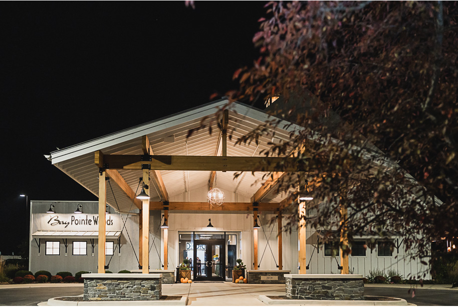 A warm fall Bay Pointe Woods wedding in Northern Michigan with sage and white details, emotional family legacy, and timeless design. Captured by Kari Dawson + Co.