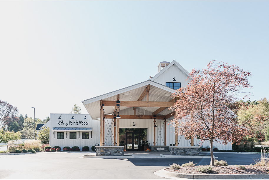 A fall Bay Pointe Woods wedding in Shelbyville, Michigan, featuring white and sage details, black-tie elegance, and heartfelt family legacy. Photographed by Kari Dawson + Co.
