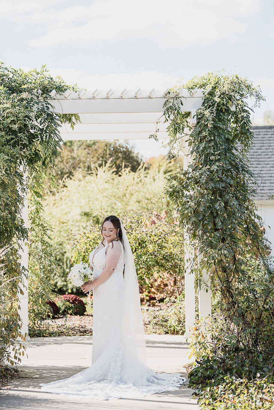 A fall Bay Pointe Woods wedding in Shelbyville, Michigan, featuring white and sage details, black-tie elegance, and heartfelt family legacy. Photographed by Kari Dawson + Co.
