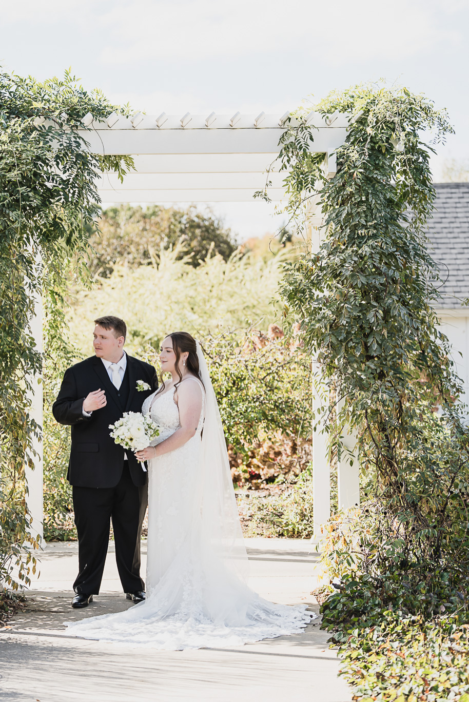 A fall Bay Pointe Woods wedding in Shelbyville, Michigan, featuring white and sage details, black-tie elegance, and heartfelt family legacy. Photographed by Kari Dawson + Co.
