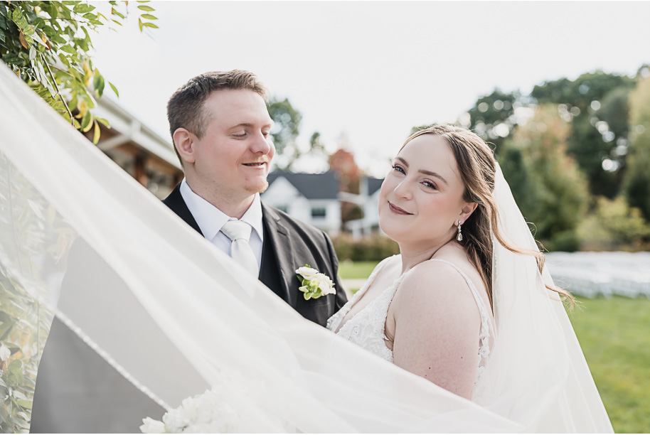 A fall Bay Pointe Woods wedding in Shelbyville, Michigan, featuring white and sage details, black-tie elegance, and heartfelt family legacy. Photographed by Kari Dawson + Co.
