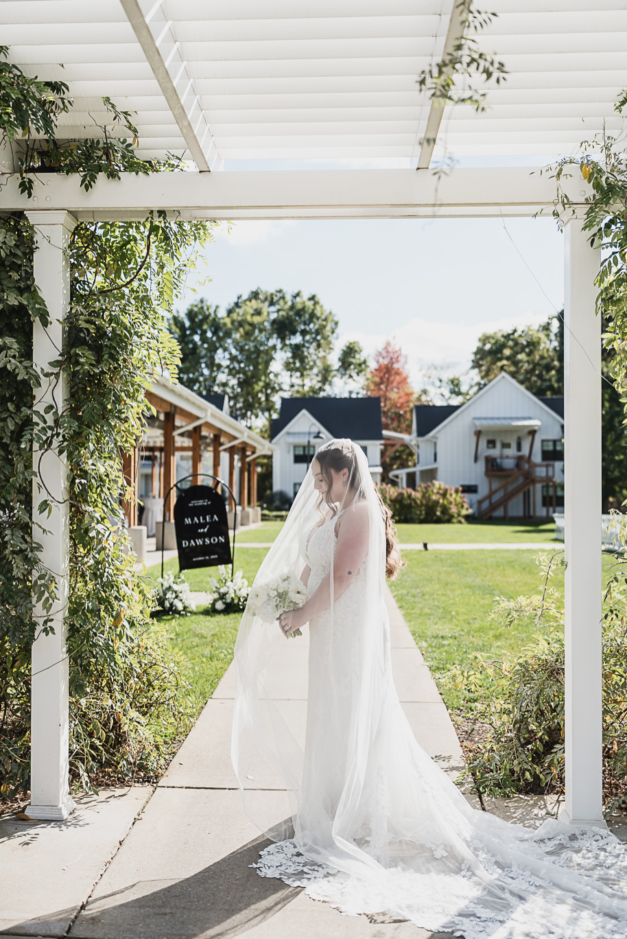 A fall Bay Pointe Woods wedding in Shelbyville, Michigan, featuring white and sage details, black-tie elegance, and heartfelt family legacy. Photographed by Kari Dawson + Co.

