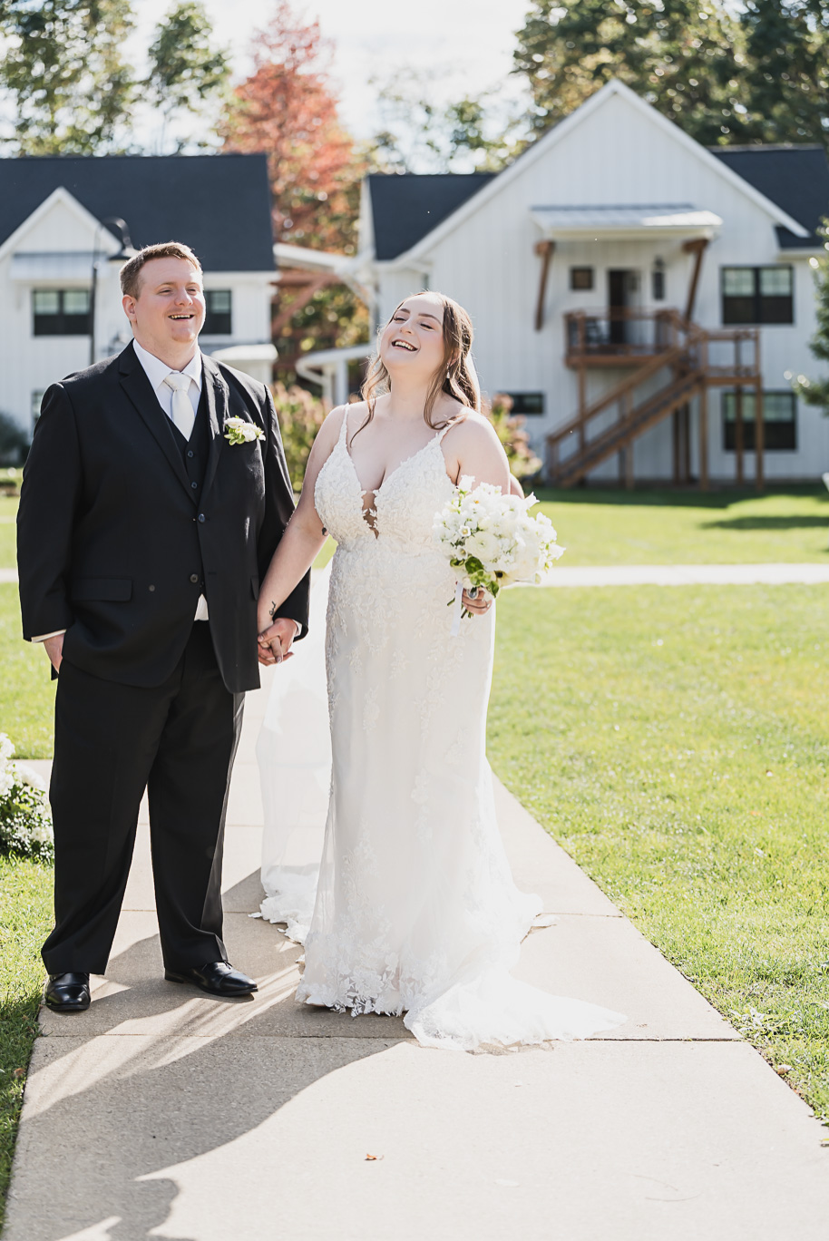 A fall Bay Pointe Woods wedding in Shelbyville, Michigan, featuring white and sage details, black-tie elegance, and heartfelt family legacy. Photographed by Kari Dawson + Co.
