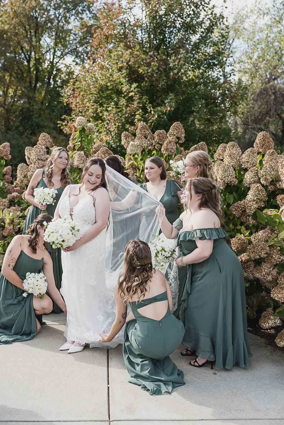 A fall Bay Pointe Woods wedding in Shelbyville, Michigan, featuring white and sage details, black-tie elegance, and heartfelt family legacy. Photographed by Kari Dawson + Co.
