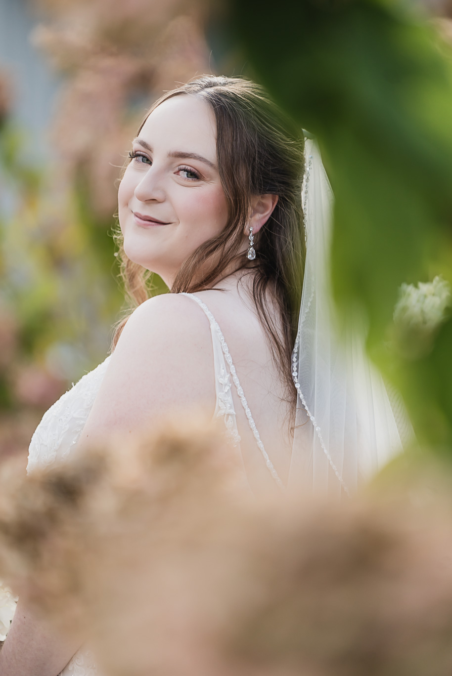 A warm fall Bay Pointe Woods wedding in Northern Michigan with sage and white details, emotional family legacy, and timeless design. Captured by Kari Dawson + Co.