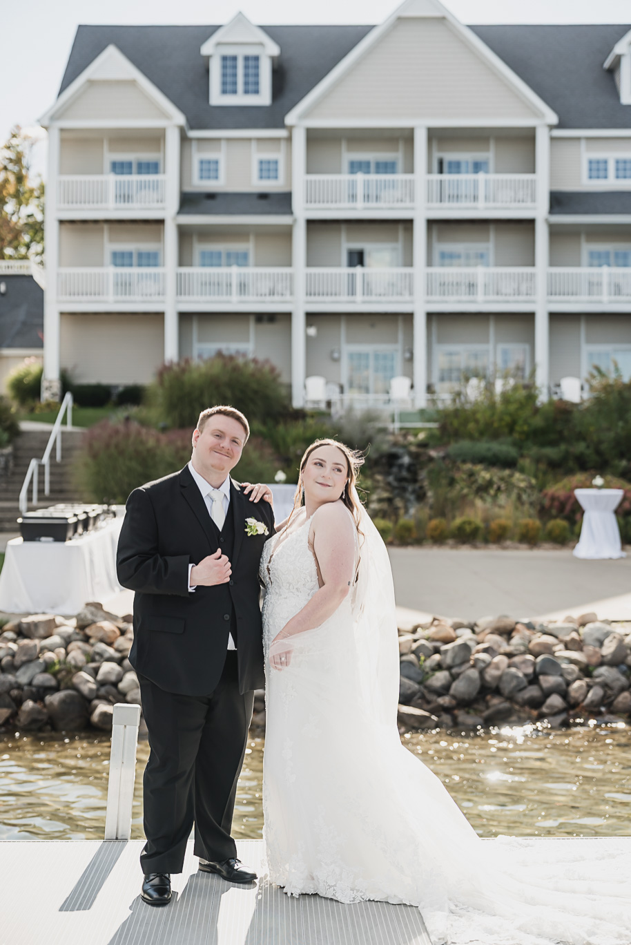 A warm fall Bay Pointe Woods wedding in Northern Michigan with sage and white details, emotional family legacy, and timeless design. Captured by Kari Dawson + Co.