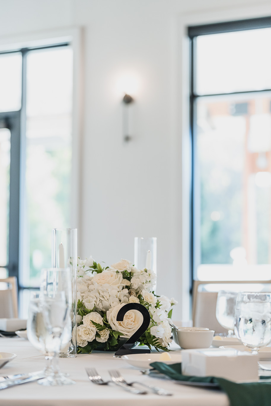 A warm fall Bay Pointe Woods wedding in Northern Michigan with sage and white details, emotional family legacy, and timeless design. Captured by Kari Dawson + Co.