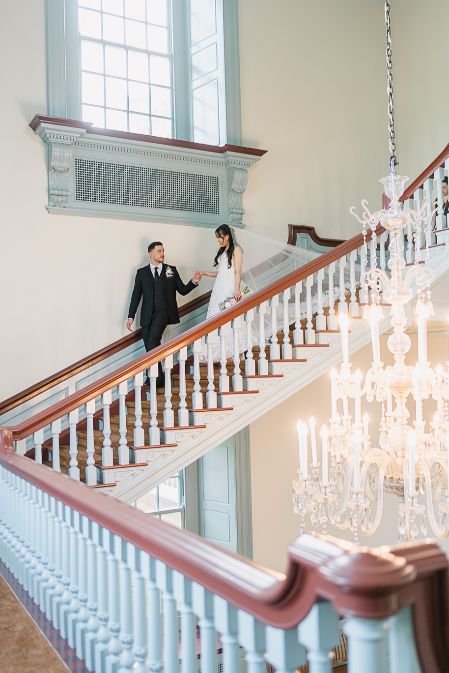 Bride and groom share an intimate moment in the iconic blue room during their Henry Ford Museum wedding. 